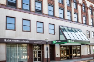 the entrance to 470 Main Street in Fitchburg, MA, with the doors to North Central Massachusetts NeighborWorks Homeownership Center and TD Bank