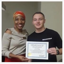 a man and a woman holding a certificate.